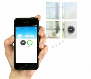 Hand holding an iPhone that is control the Wifi thermostat.